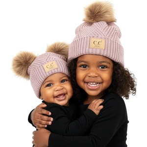image:imageFunky Junque Matching Infant amp Toddler Pom Beanies  Winter Knit Hats for Baby Girls amp Siblings Adorable SetDiagonal Stripes  Rose 2 Pack  1 Toddler 14 Years  1 Infant 012 Months