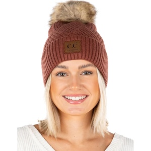 image:imageFunky Junque Womens Pom Pom Beanie  Soft Knit Winter Hats for Women amp Teens Warm Fashionable Beanie with Faux Fur PomsDiagonal Stripes  Brick