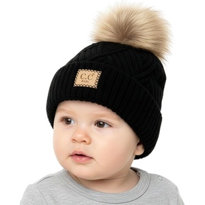 image:imageFunky Junque Baby Pom Pom Beanie  Soft Knit Infant Winter Hat for Baby Girls amp Boys Cozy Warm Newborn Beanie 012 MonthsDiagonal Basketweave Pattern  Black