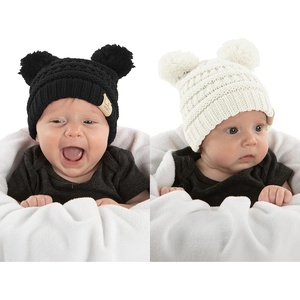 image:imageFunky Junque Double Pom Pom Baby Beanie  Newborn Girl Winter Hat 012 Months Cute Cozy Knit Infant Beanies for Cold Weather2 Pack  Black  Ivory  Double Pom