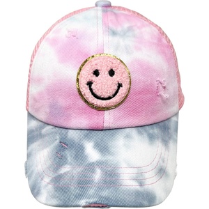 image:imageFunky Junque Girls Criss Cross Ponytail Baseball Cap Kids Messy Bun Hat  Lightweight mesh cap with criss cross elastic bands for camping playgrounds softball volleyball amp recessSmiley Face  Tie Dye Baby PinkPink