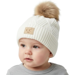 image:imageFunky Junque Baby Pom Pom Beanie  Soft Knit Infant Winter Hat for Baby Girls amp Boys Cozy Warm Newborn Beanie 012 MonthsDiagonal Basketweave Pattern  White